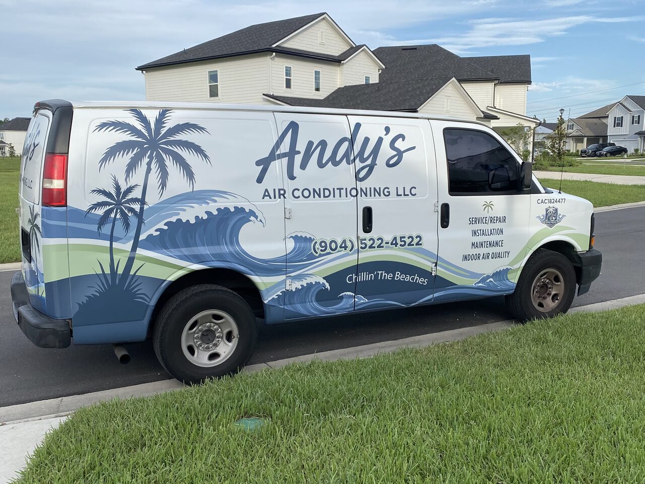 Andy's Air Conditioning van with its palm-and-wave graphics parked at a Jacksonville-area home